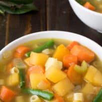 Orange, yellow and green vegetables in a soup