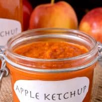 A closeup of a jar of apple ketchup