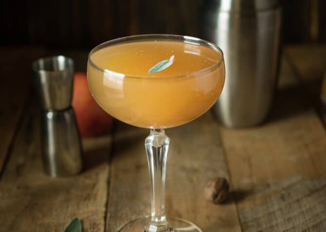 An apple sidecar cocktail with nutmeg