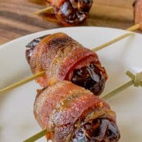 Crispy bacon wrapped around an apple stuffed date
