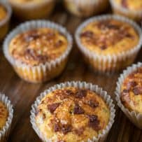 A collection of bacon cheddar corn muffins on a board