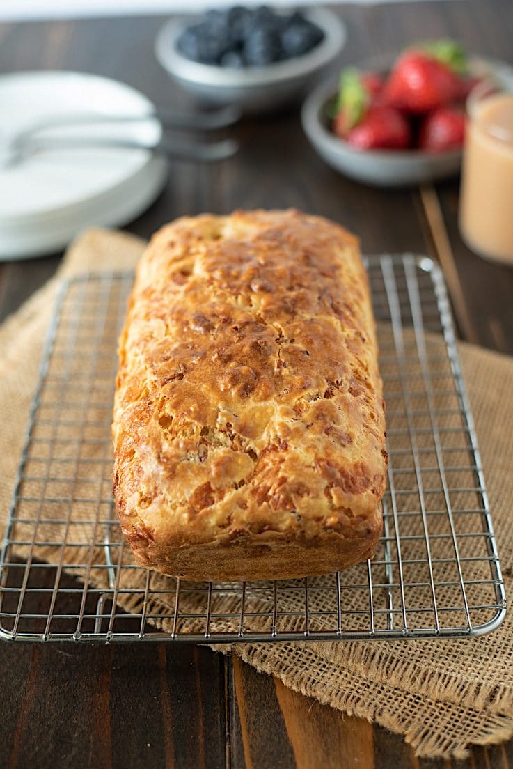 A loaf fresh out of the oven cooling on a rack