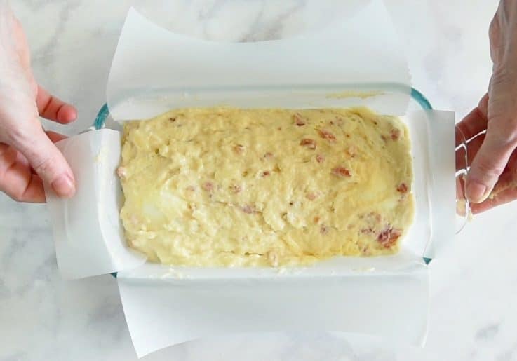 The mix is poured over the eggs and it's ready to bake