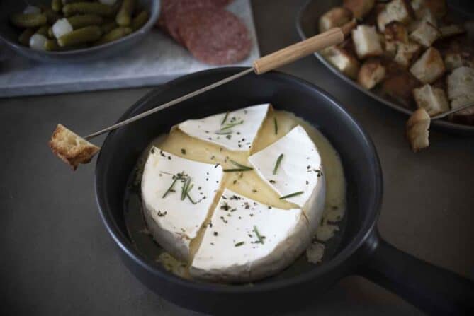 Melted brie fondue in a dish with bread
