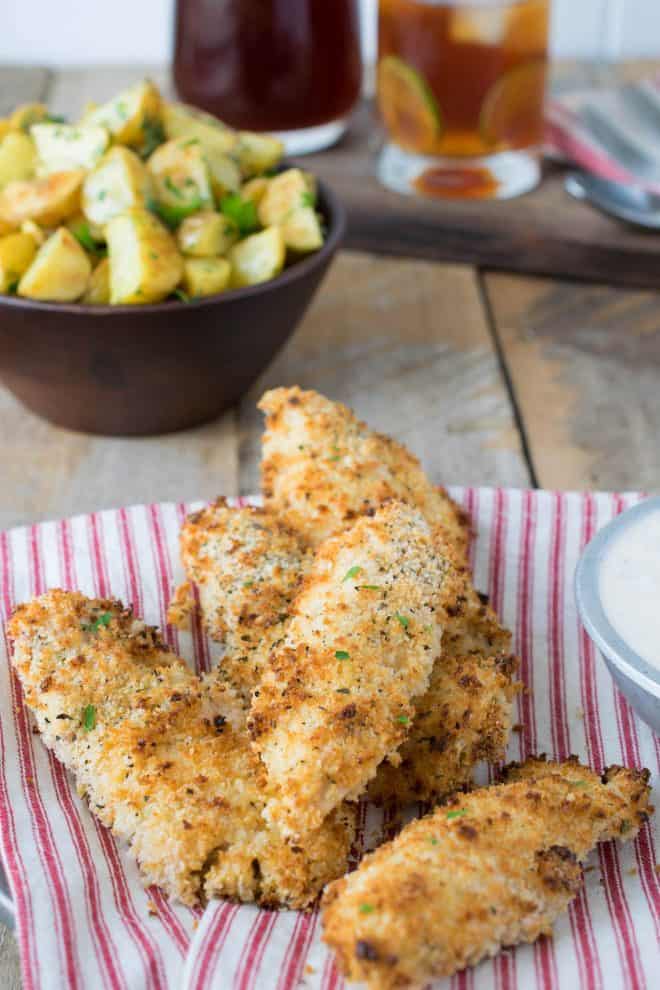 Breaded chicken tenders on a striped cloth
