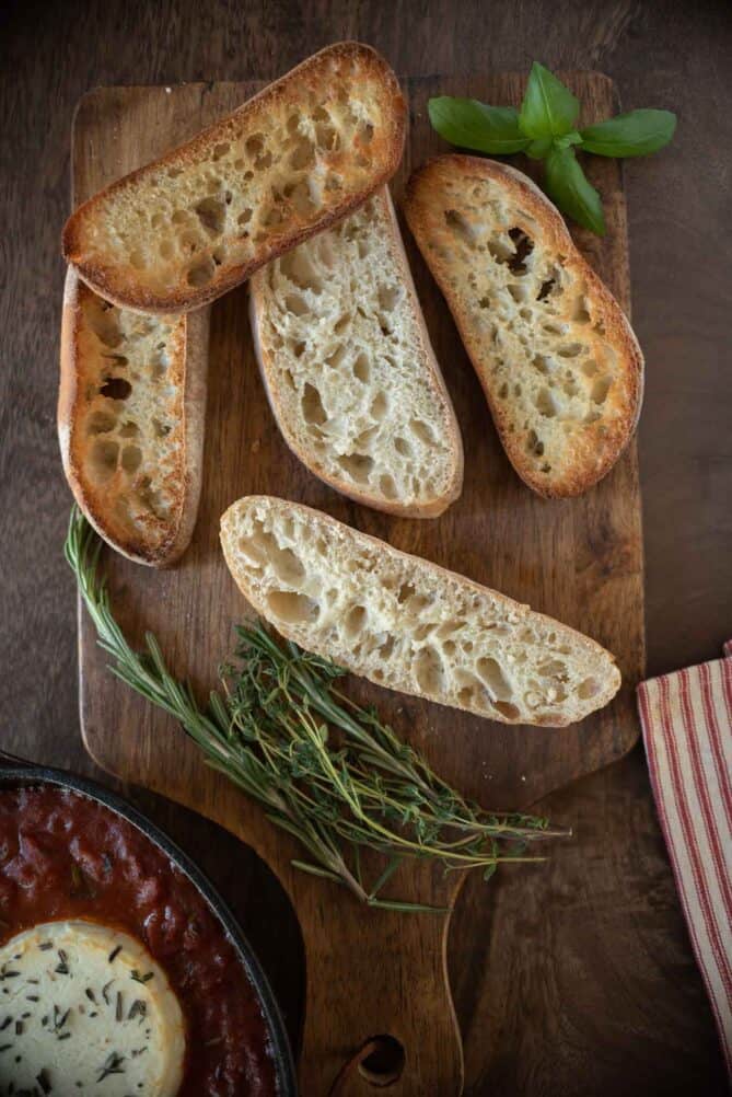 Slices of ciabatta bread on a board