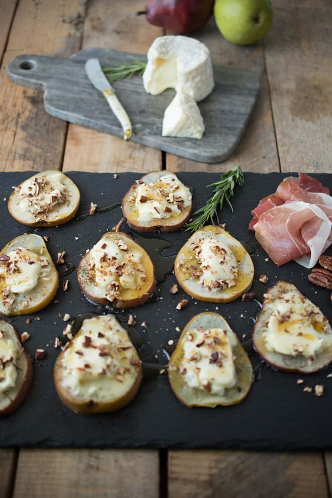 Served on a slate platter with prosciutto and more cheese