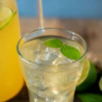 A closeup of a glass of basil ginger lime tea