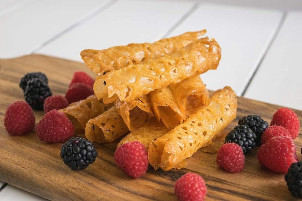 Tubed cookies stacked with fruit