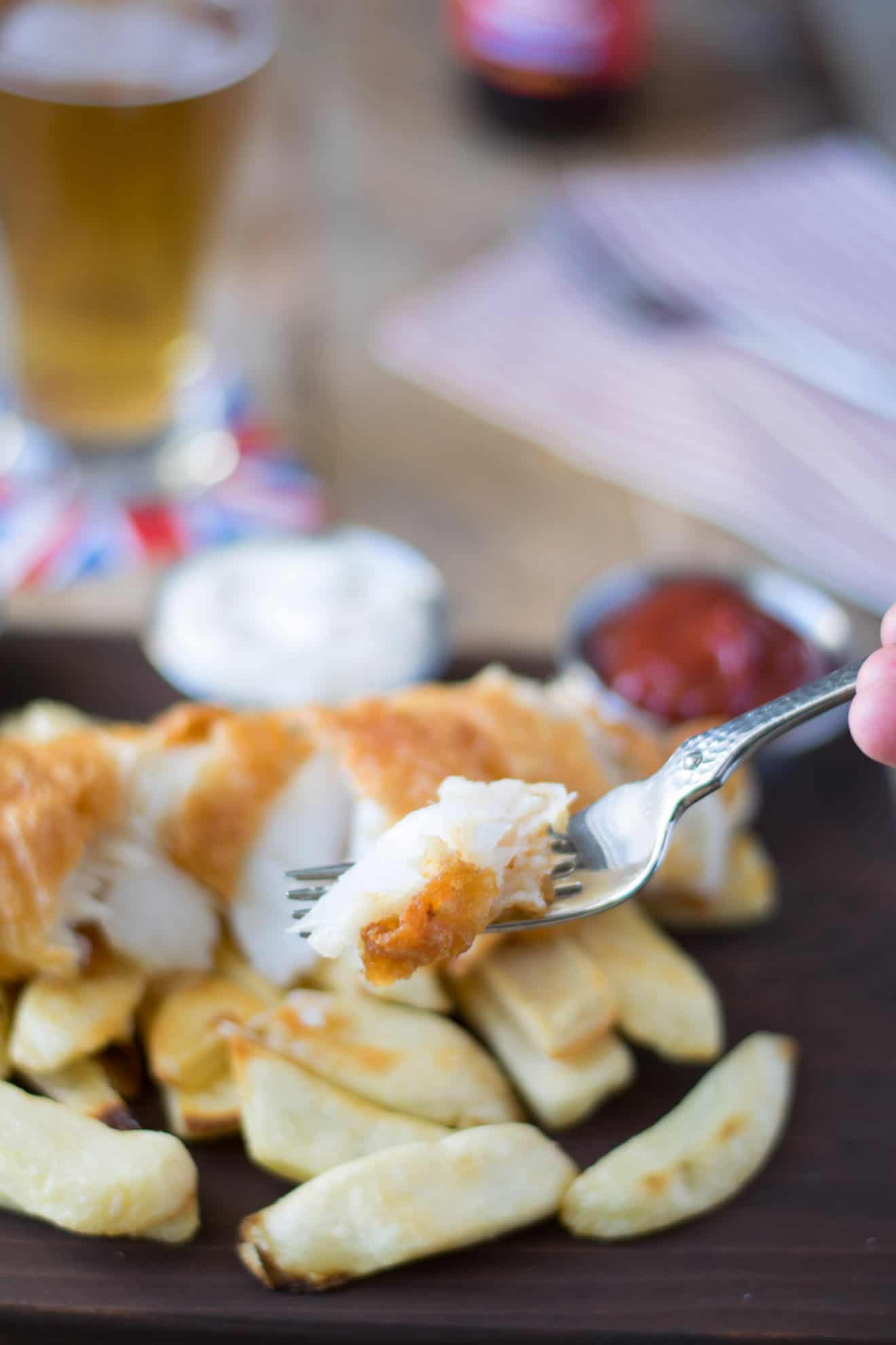Flaky fried fish on a fork