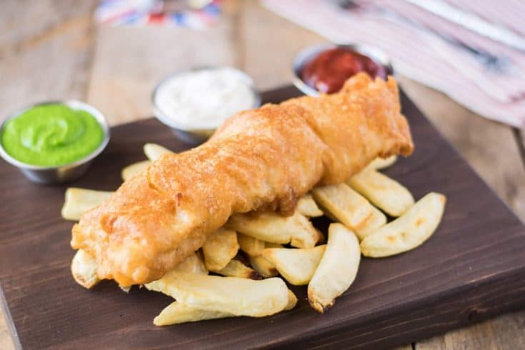 British fish and chips served with peas, ketchup and tartar sauce