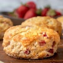 A golden brown, flaky scone made filled with fresh strawberries