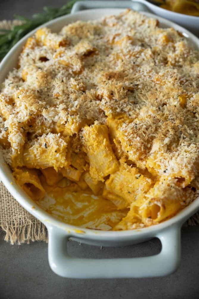 Pasta removed from a dish showing the orange sauce