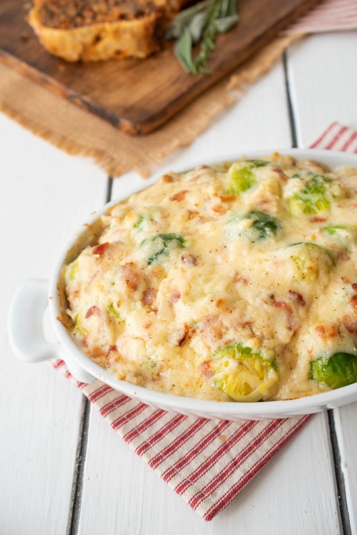 Brussels sprouts covered in a bacon cheese sauce