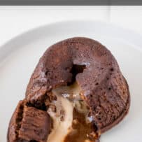 A chocolate cake with the center oozing out onto a plate