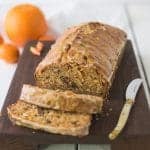 Carrot ginger spiced bread on a cutting board sliced