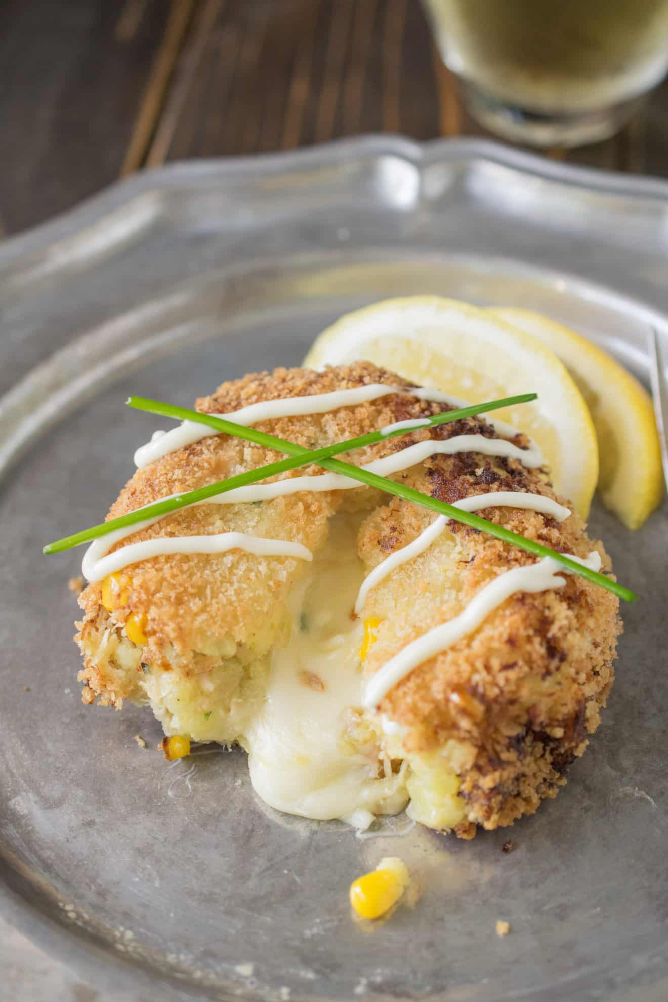 A cheesy tuna melt cake cut open with cheese oozing out