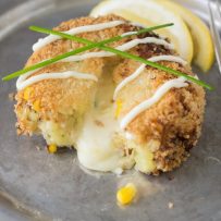 A cheesy tuna melt cake with a fork