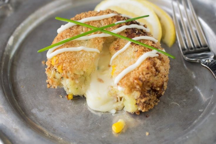 A cheesy tuna melt cake with a fork