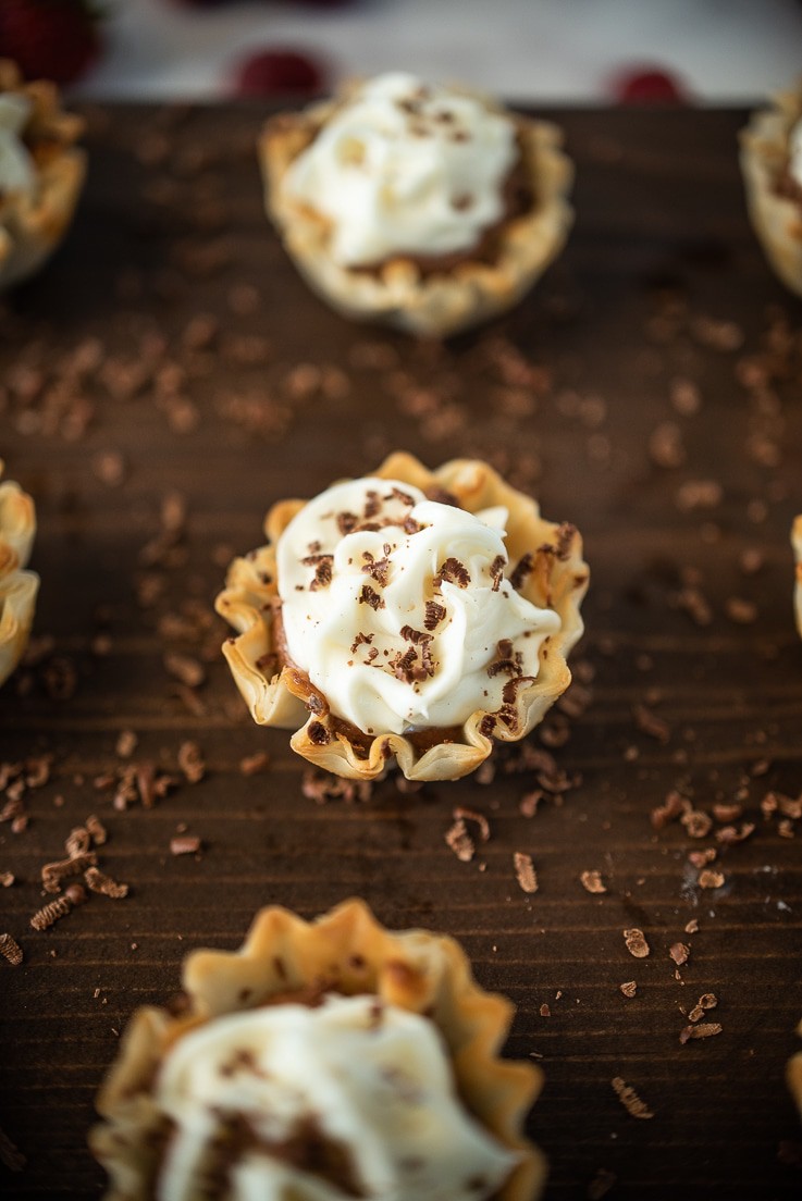 A closeup of a Chocolate mousse and vanilla phyllo dessert cups
