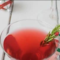 A vibrant red cocktail in a stemless glass viewed from overhead
