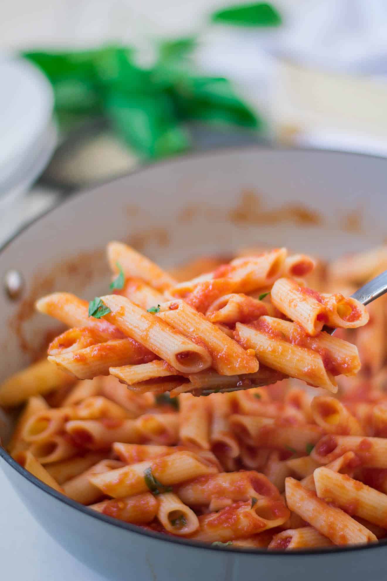 Classic penne all'arrabbiata on a serving spoon