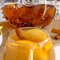 Apple cider mixed with cognac in a short rocks glass with