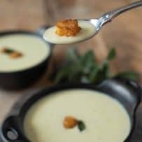 A spoonful of Cornbread, Sage & Onion soup with a cornbread crouton