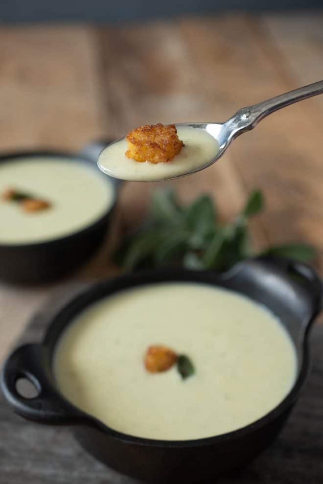 A spoonful of Cornbread, Sage & Onion soup with a cornbread crouton