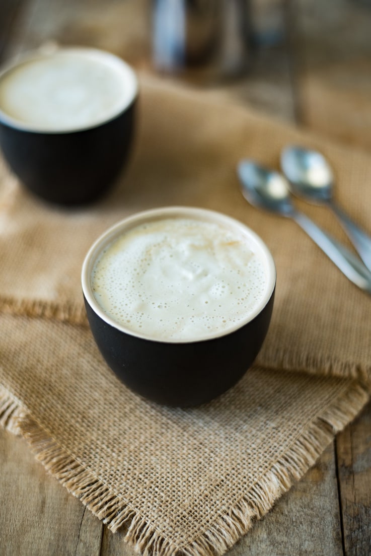 This creamy almond coconut cashew coffee will be your new chilly morning wake-me-up drink that is dairy free. Healthy almond milk is blended and thickened with coconut oil, cashews and a little honey for a creamy coffee creamer. This is Bulletproof coffee meets healthy latte.