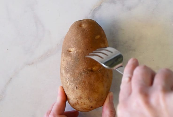 Pierce a potato all over with a fork