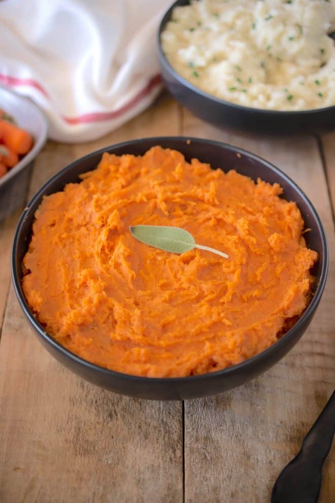 A bowl of vibrant orange sweet potato/yam mash