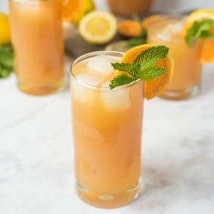 A brightly colored lemonade in a glass