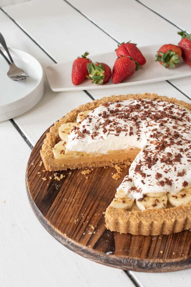 A banoffee pie with a slice removed