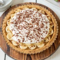 A whole banoffee pie on a round board