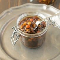 A spoon inside a jar of English pickle relish