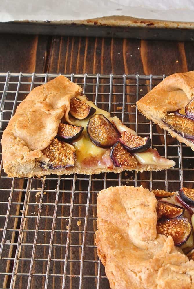 A slice of fig and Brie Galette on a cooling rack