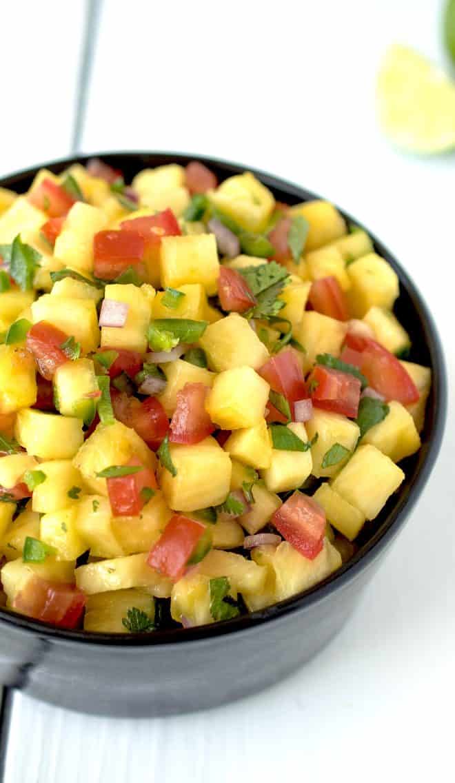 A closeup of the colorful salsa showing the red tomato and green cilantro
