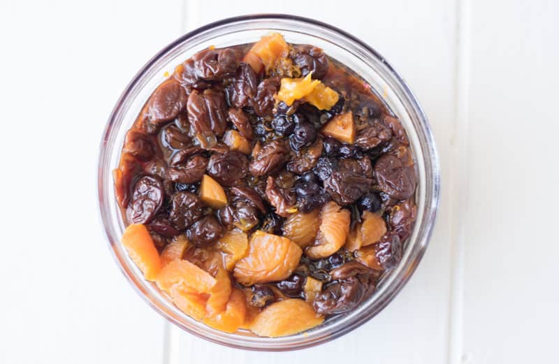 A bowl of dried fruit soaking in tea