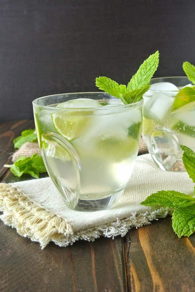 A side view of a clear cocktail in a short glass