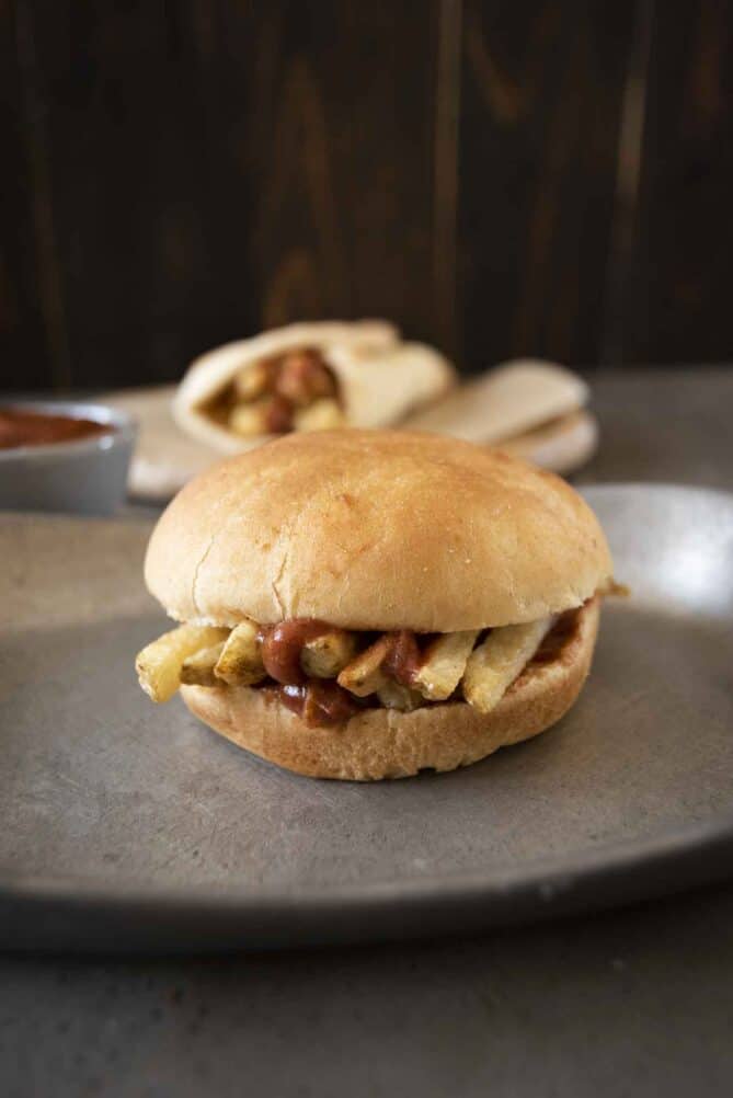 Chip/French Fries inside a bun with ketchup