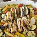 A closeup showing the grilled chicken and colorful vegetables