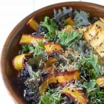 A closeup of the colorful shaved carrots in the salad