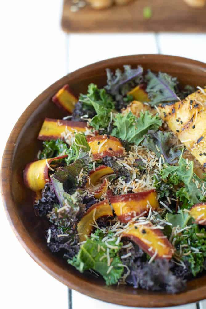 A closeup of the colorful shaved carrots in the salad