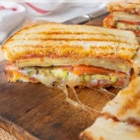 Slices of grilled vegetables and cheese in panini