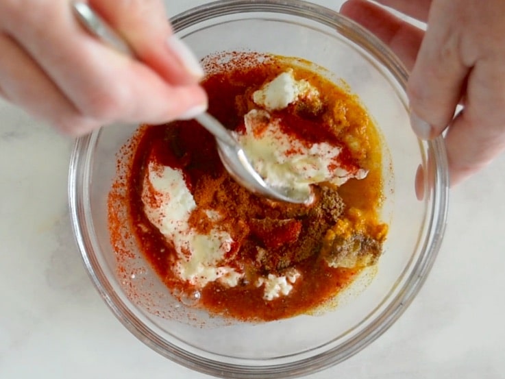 Greek yogurt and spices get mixed