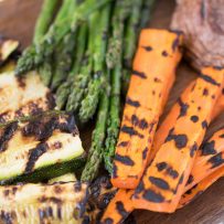 A closeup of grilled vegetables showing the grill marks