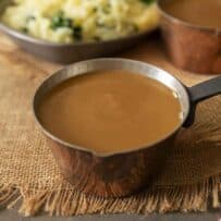 A small copper pot filled with gravy