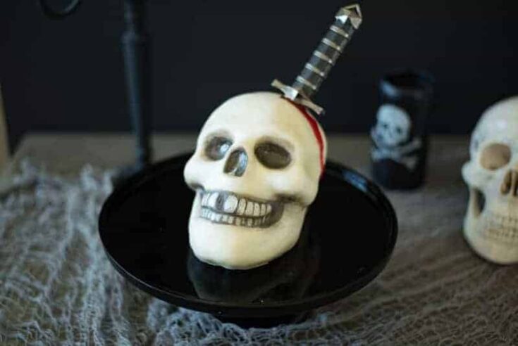 This Halloween skull and dagger cake is a fun and spooky centerpiece that will be sure to scare any Halloween partygoers. This cake can also serve as desserts for &nbsp;your guests, if they dare to eat it.