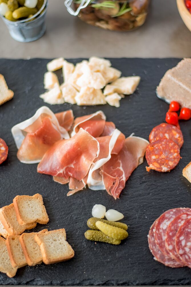 A charcuterie platter with meats and cheeses
